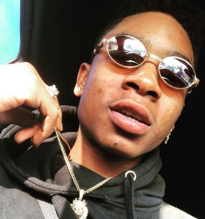 Rj cyler is showing his neck chain.